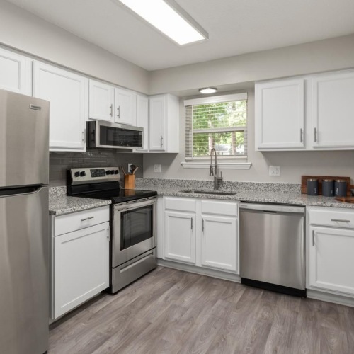 a kitchen with white cabinets
